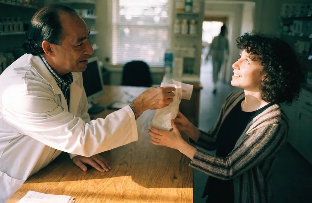 A pharmacist helping a customer